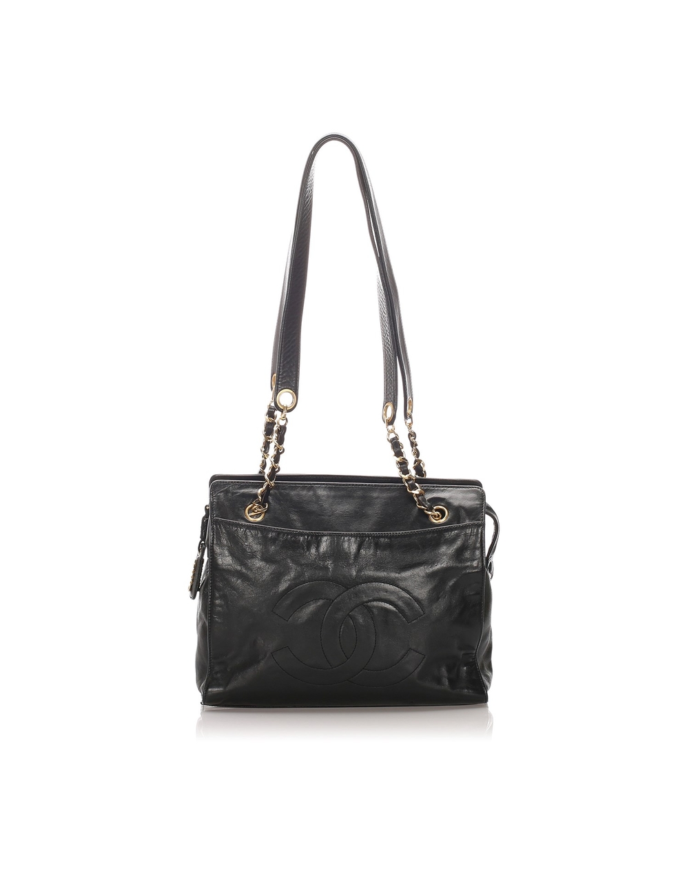 This tote bag features a lambskin leather body, a front exterior slip compartment, flat leather hand
