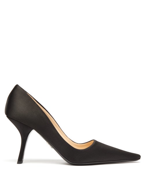 Prada - The slanted heel of Prada's black pumps encapsulates the house's futuristic codes. They're m