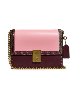 From the Coach x Jennifer Lopez Collection. Trimmed with luxe snakeskin, this colorblock leather bag