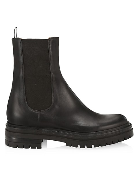 Exuding a rugged, utilitarian charm, these combat boots feature a smooth leather construction and ch