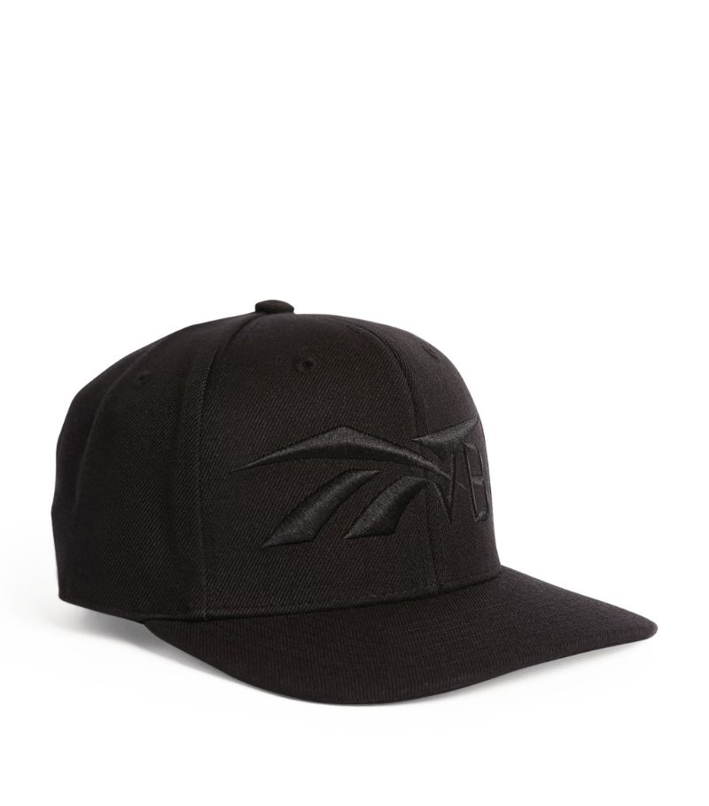 This sleek cap is presented as part of Reeboks collaboration with Victoria Beckham, uniting the athl
