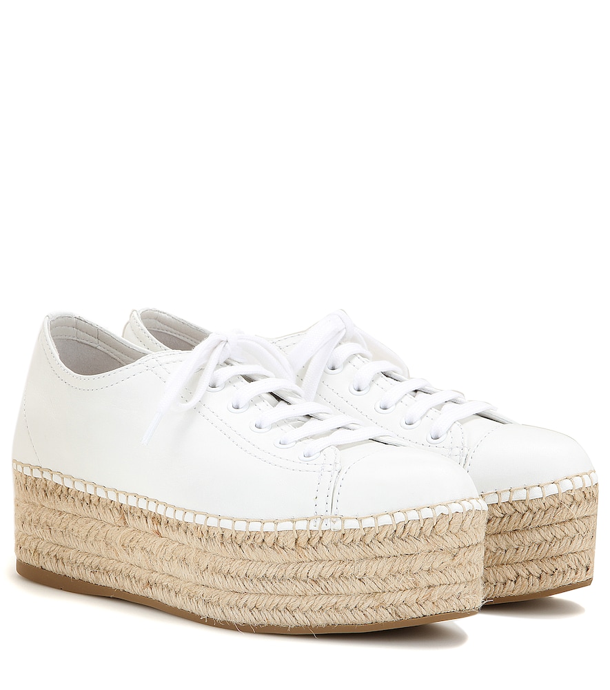 Refresh your look for the new season with Miu Miu's espadrille-style sneakers.