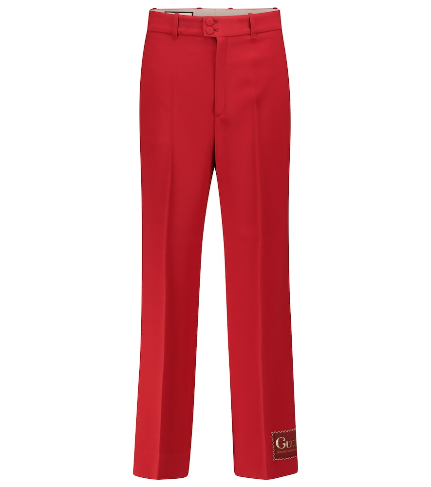 These red pants encapsulate the vintage aesthetic championed throughout Alessandro Michele's tenure 