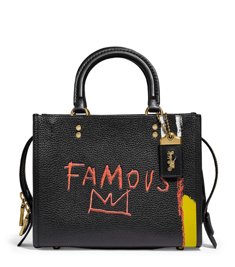 Hailing from a collaboration with NYC-based artist Jean Michel Basquiat, this petite Coach accessory