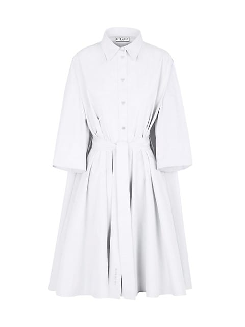 A classic silhouette is reimagined in a modern way. This crisp cotton shirtdress is cinched with a s