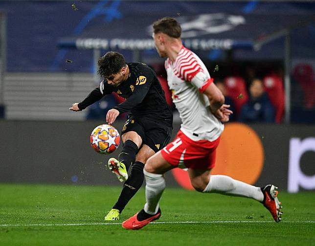 Brahim Diaz (L) of Real Madrid goes for goal during the UEFA Champions League last 16 1st Leg match against RB Leipzig in Leipzig, Germany, on Feb. 13, 2024. (Xinhua/Ren Pengfei)