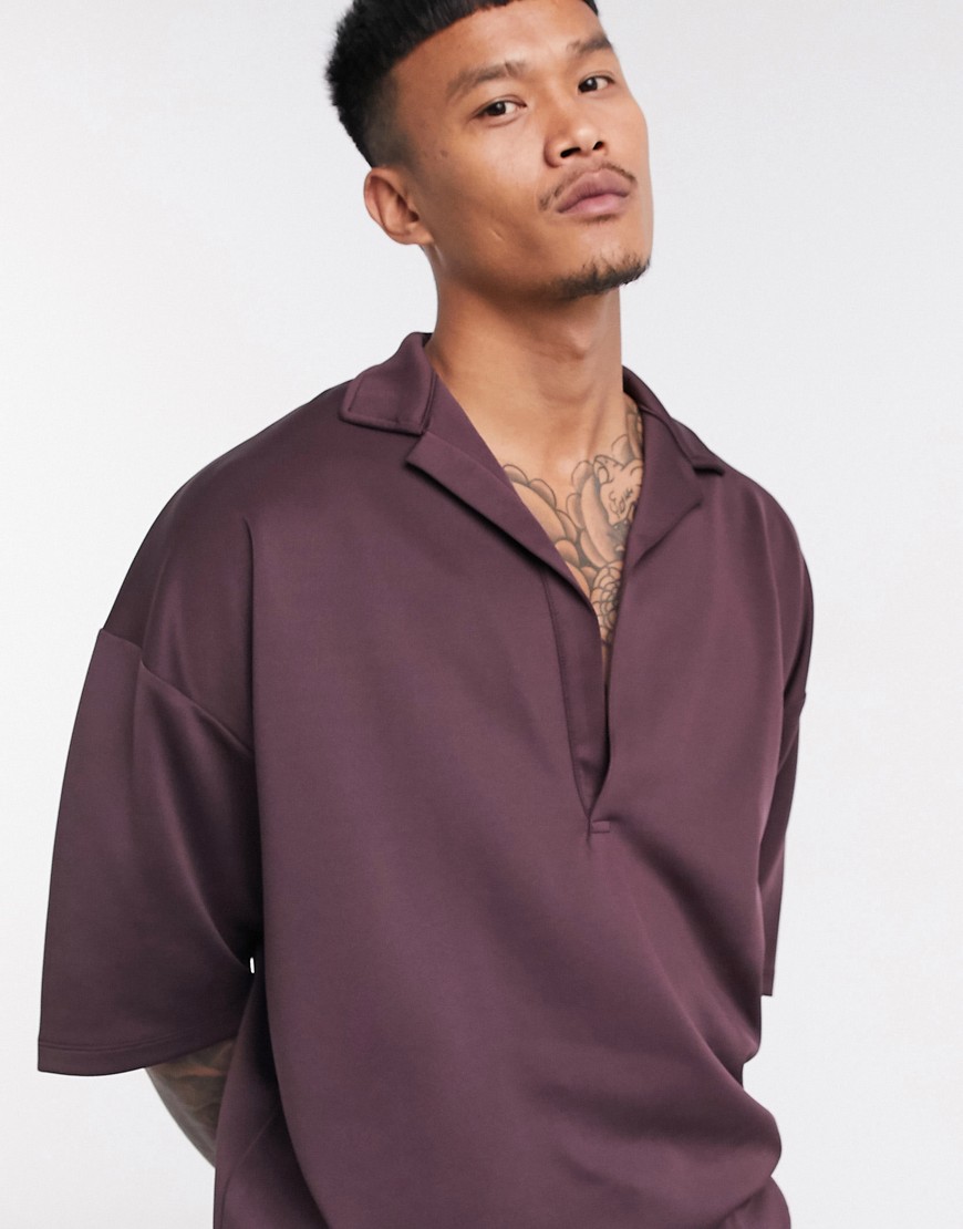 Polo shirt by ASOS DESIGN Aesthetic: on point Deep revere collar Drop shoulders Oversized fit Relaxe