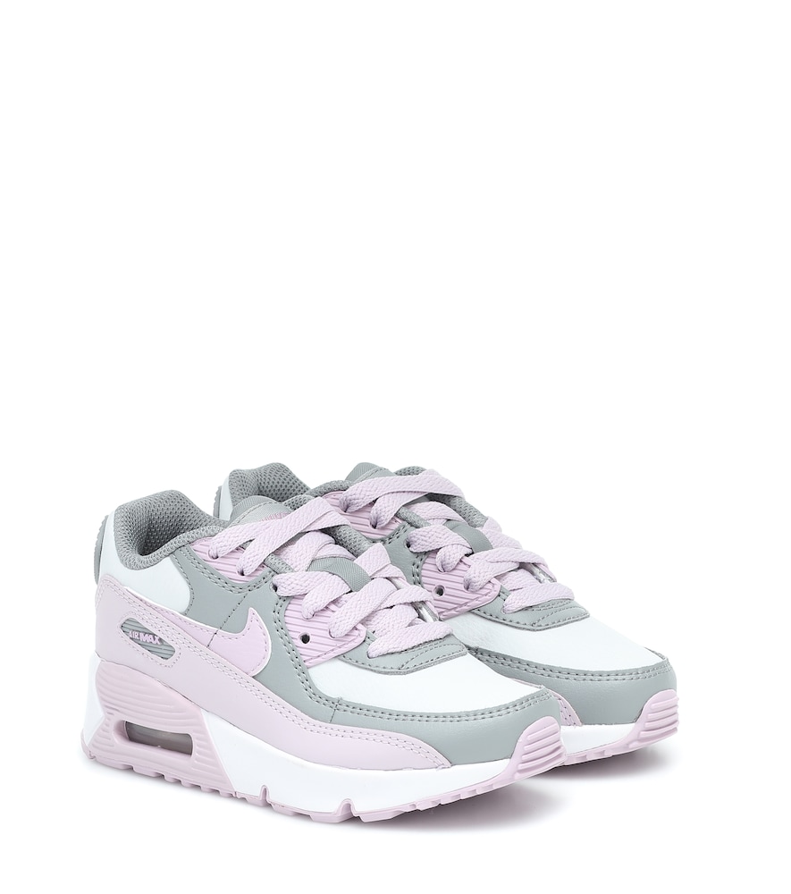 Tiny toes will love this petite pair of Air Max 90 sneakers from Nike Kids.