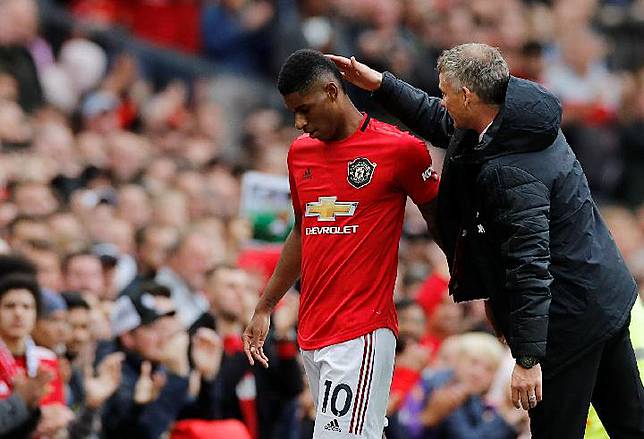 Pemain Manchester United Marcus Rashford dan pelatih Ole Gunnar Solskjaer. REUTERS/Phil Noble