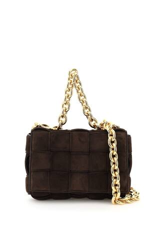 The Chain Cassette bag by Bottega veneta, enhanced by a woven construction made from tone-on-tone double-faced padded suede straps. Maxi chain top handle and shoulder strap, front flap with snap closure, unlined interior with one zip pocket. Gold-tone metalware.