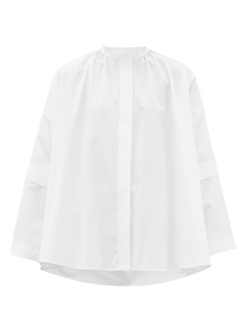 Jil Sander - Channelling the label's signature minimalist mood, Jil Sander's white shirt is cut to a