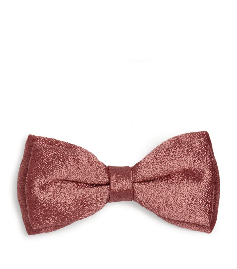 Becoming something of a signature for the London-based label, delicate bows can be found adorned to 