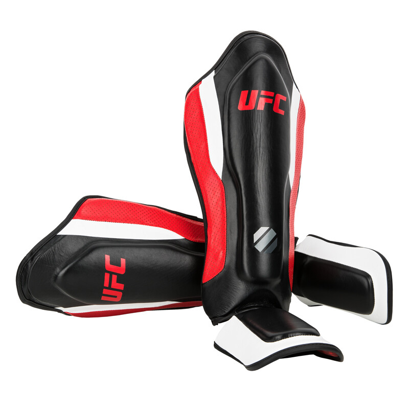 UFC-PRO護脛腿部訓練護具 (終極格鬥/拳擊防護/小腿保護/腳踝/MMA) 特色 一、頂級牛皮革製成。 二、超過2.54公分的結構，強化保護腳脛和腳背。 三、D形環皮革製魔鬼氈，穩固耐用。 四、腳