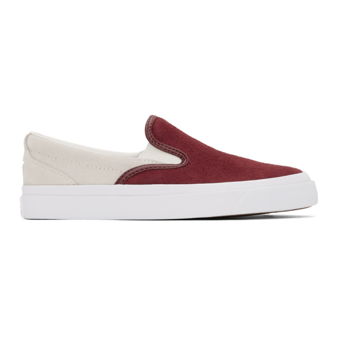 Low-top slip-on suede sneakers colorblocked in green and off-white. Round toe. Elasticized gussets a