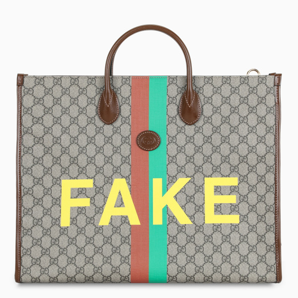 Shopping bag by Gucci in beige and ebony GG Supreme canvas, featuring Web stripe, print on the front