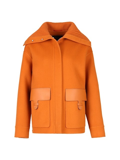 Tailored with a sleek short cut, this double faced baby cashmere coat features an oversized rib-knit