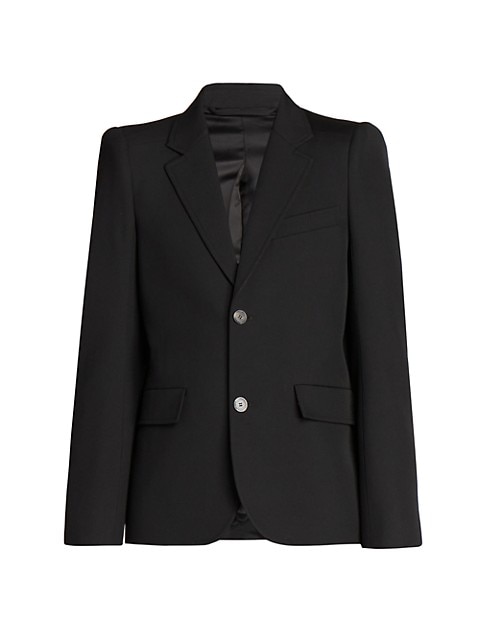 Crafted of rich wool, this polished tailored blazer is cut with a curved shoulder that offers soft s