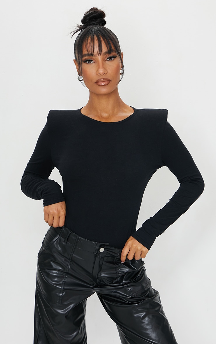 Black Cotton Mix Shoulder Pad Bodysuit nUpdate your wardrobe essentials with this bodysuit doll Feat