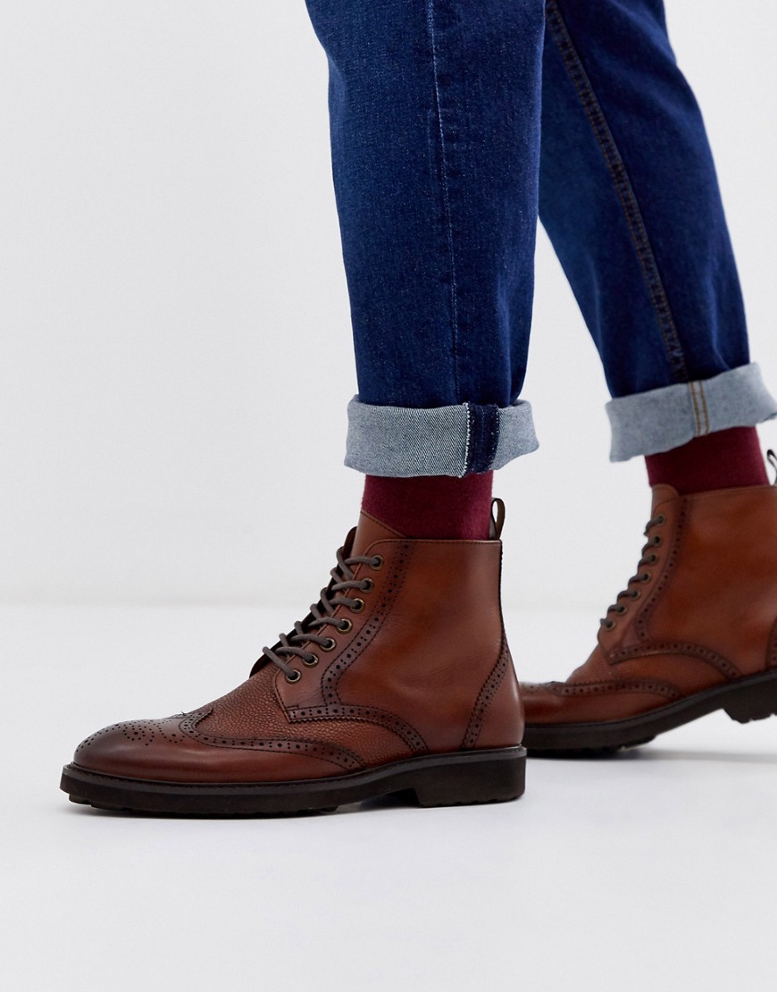 Boots by Office They've already got your attention Lace-up fastening Round toe Pull tab Textured tre
