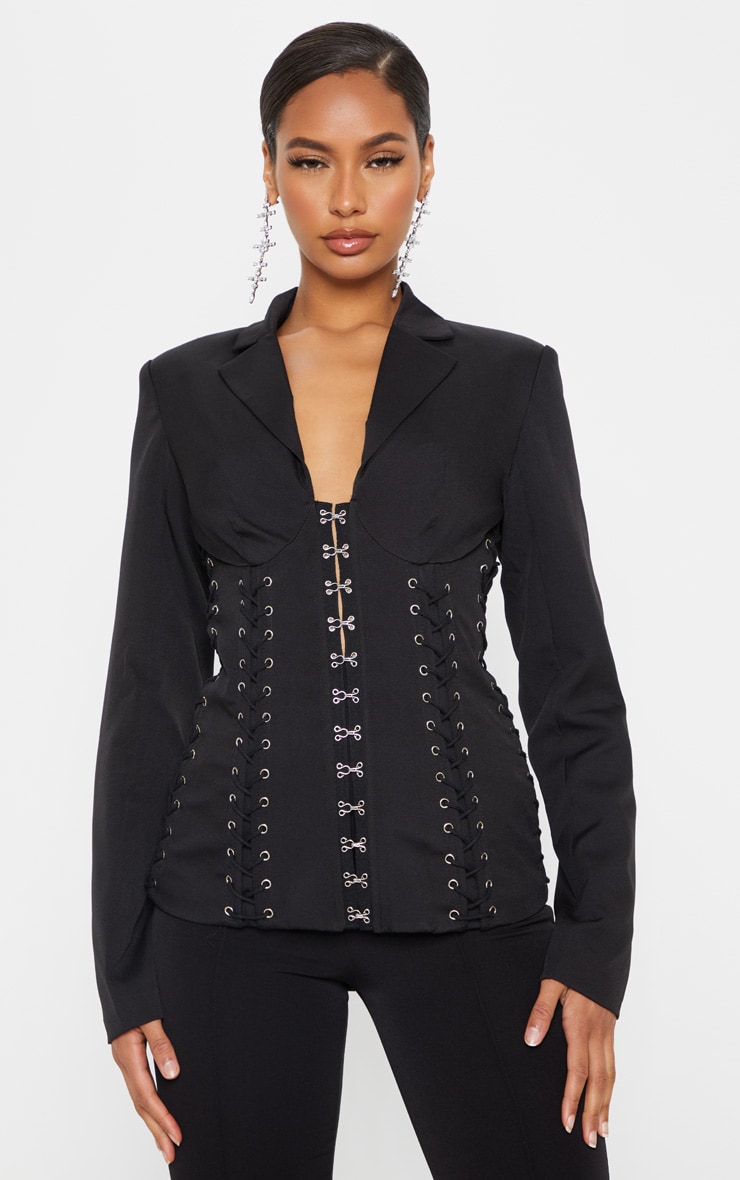 Black Boned Lace Up Corset Blazer nChannel some boss girl vibes with this blazer doll Featuring a bl