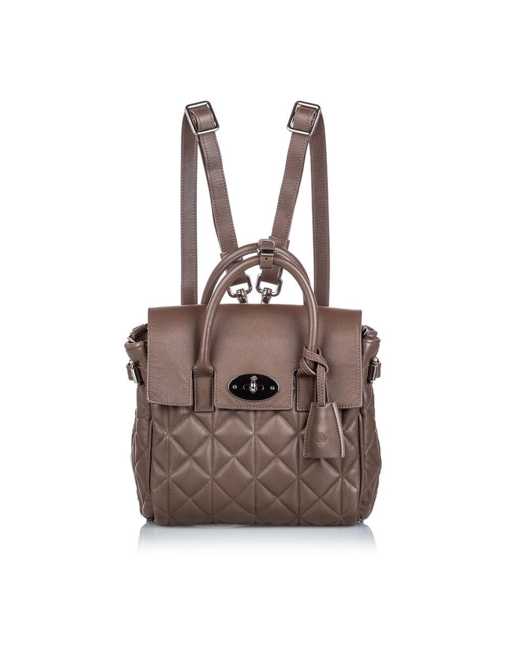 產品詳情： 棕色桑樹Qui縫Cara Delevigne背包。 Cara Delevingne背包採用a縫皮革主體，卷式提手，平後綁帶，頂部翻蓋和旋轉鎖扣，外部拉鍊袋以及內部拉鍊袋和滑動袋。 9英寸長