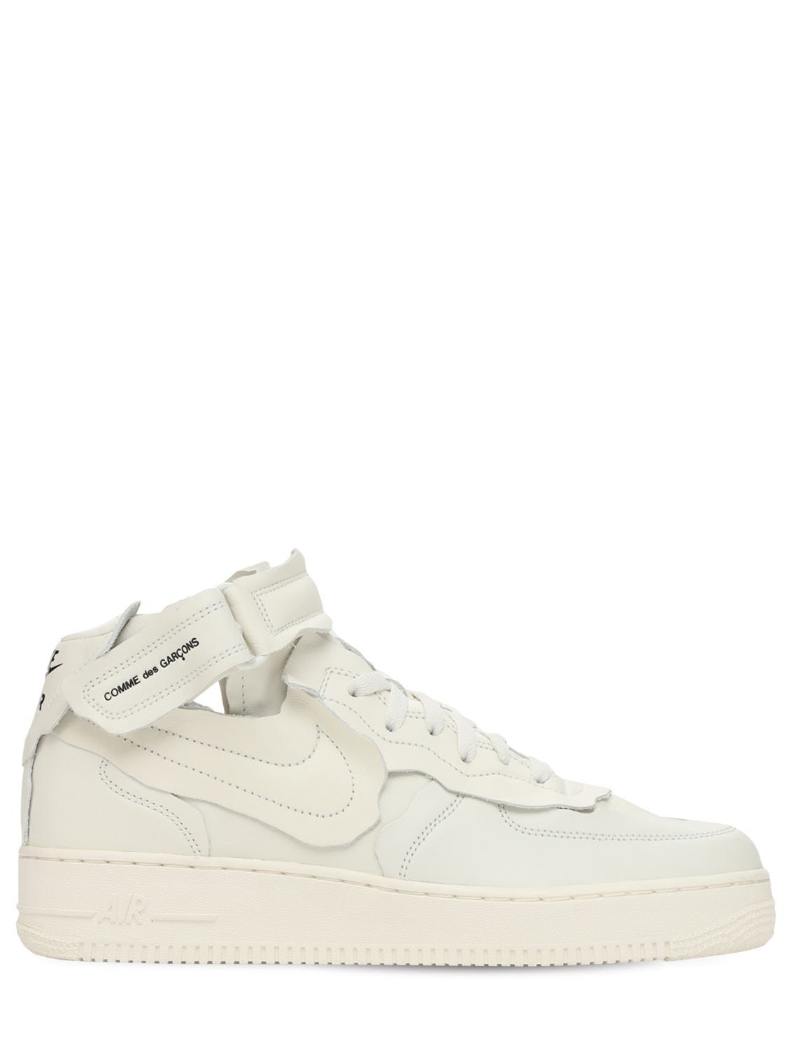 Leather upper. Front lace-up closure. Adjustable hook and loop ankle strap. Logo details. Rubber sol