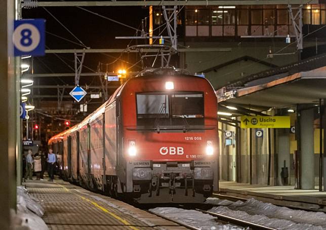 In this file photo taken on February 23, 2020 a night train of the Osterreichische Bundesbahnen (OBB) Austrian railway company stands on a platform at the railway station in Gries am Brenner at the Austrian-Italian border.