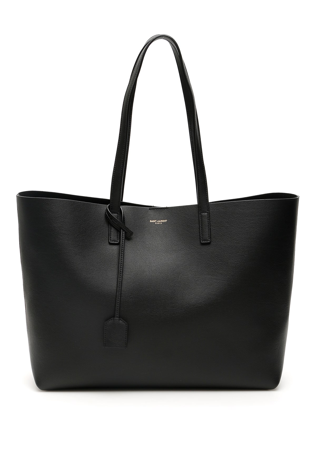 Saint Laurent East West leather shopping bag. Unstructured model with two handles, it may be worn by