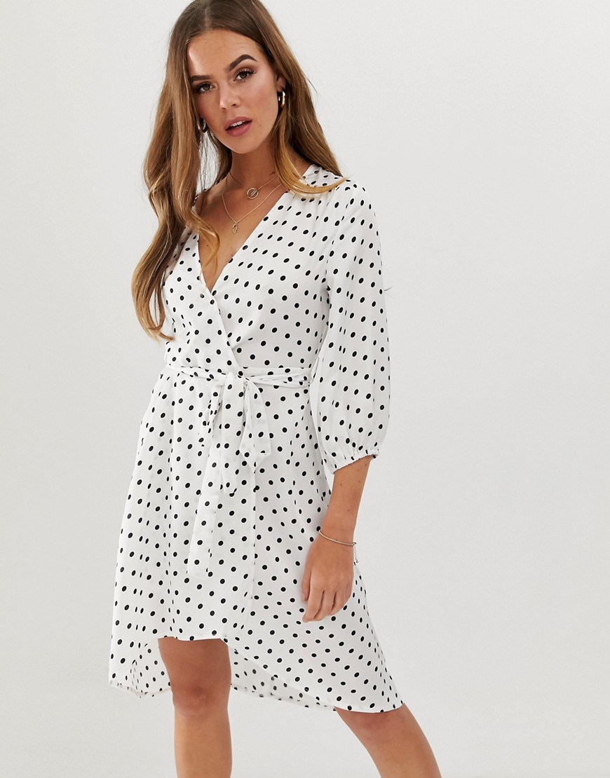 Dress by In The Style Polka-dot design It's spot on V-neck Wrap design Tie waist Regular fit No surp