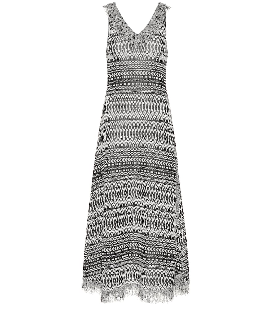 A geometric striped print and fringed trim lend this dress from Loewe a carefree feel.