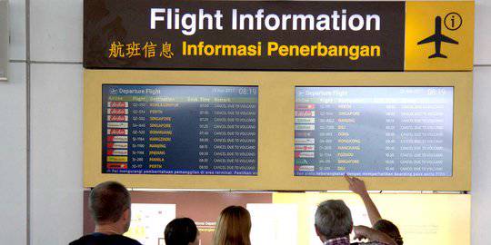 Ribuan penumpang tertahan di Bandara Ngurah Rai. &copy;AFP PHOTO/Juni Kriswanto