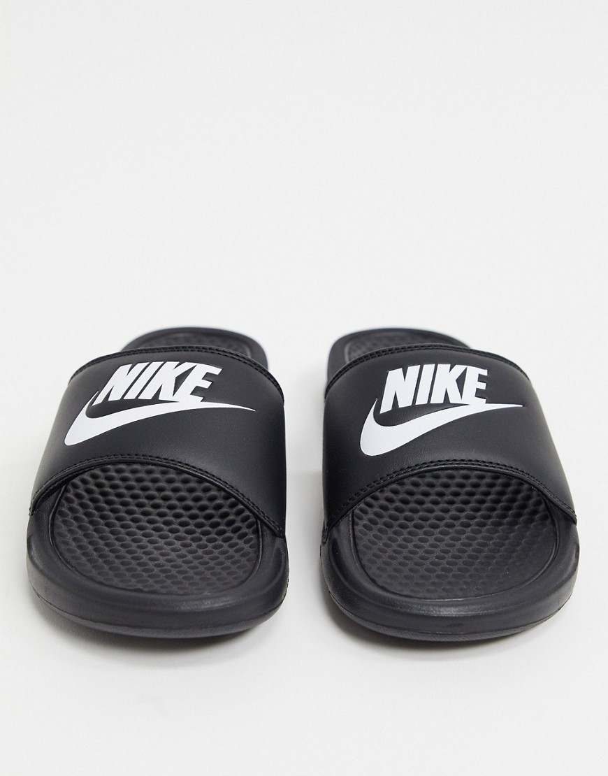 Sandals by Nike The millennial slipper Wide-cut, branded strap Slip-on style Open toe Flat sole Text