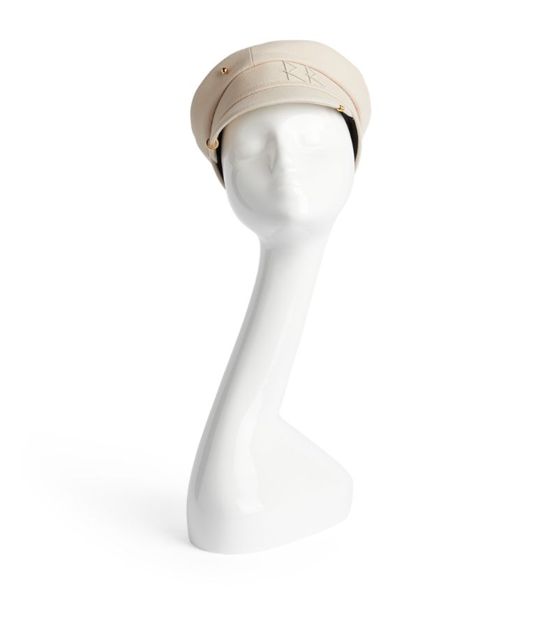 Rumour has it that Ukrainian milliner Ruslan Baginskiy was inspired by the uniform of a conductor wh