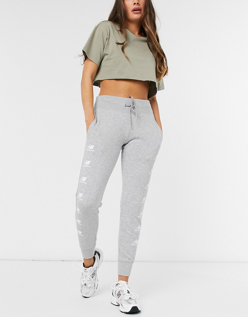 Joggers by New Balance Can't go wrong in sweats Elasticated drawstring waist Side pockets Logo print