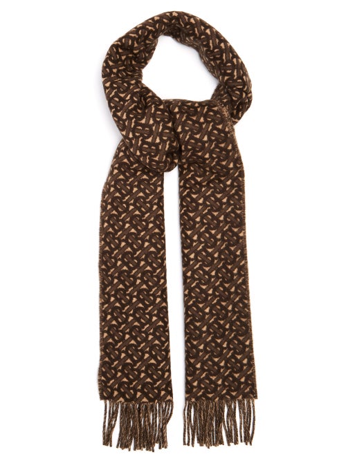 Burberry - Burberry showcases its signature palette of neutrals with this beige scarf, which is jacq