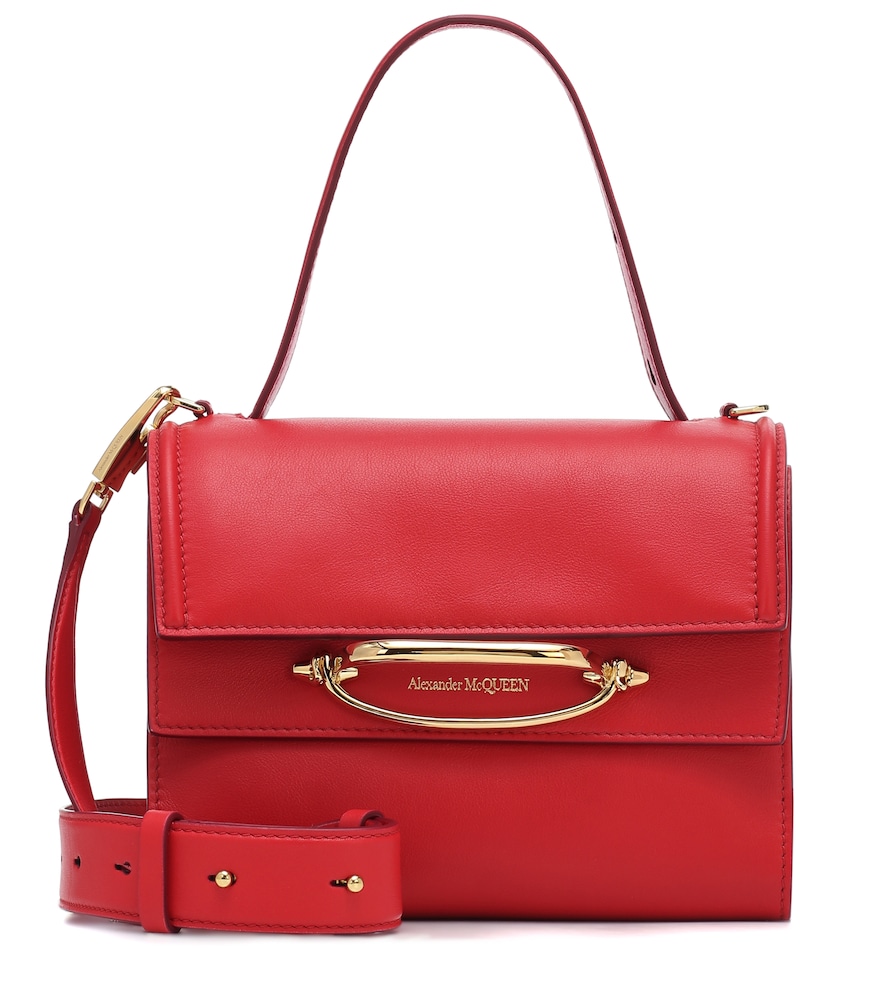 This red The Story shoulder bag from Alexander McQueen can be styled four ways - carried from both h