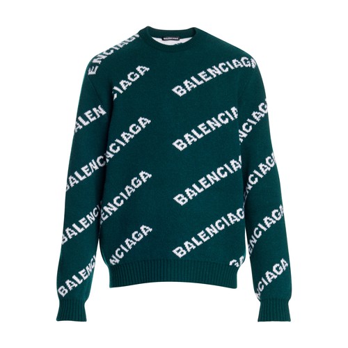 Balenciaga reinterprets a traditional round neck, woollen jumper with the addition of several crossi
