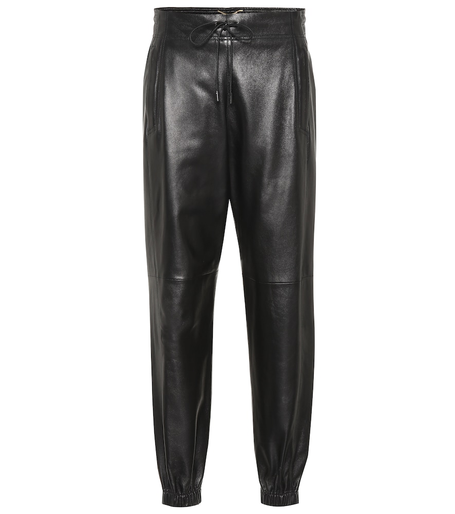 Saint Laurent's pants work a sporty silhouette, defined by cuffed ankles and a drawstring waist, but