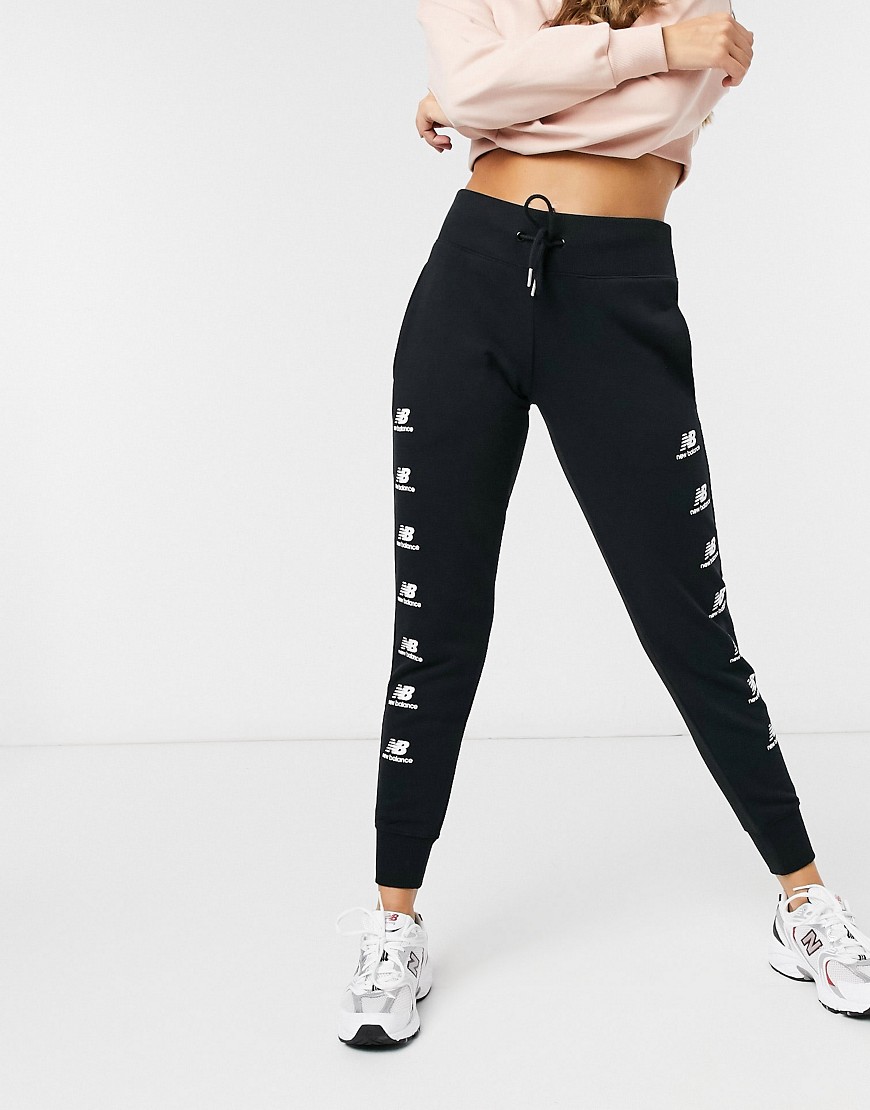 Joggers by New Balance Dressed to chill Elasticated drawstring waist Side pockets Logo print to legs