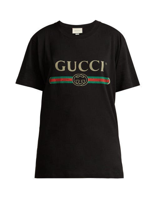 Gucci - Gucci continues its affinity for logos, as seen in this black T-shirt. Made in Italy, it's c