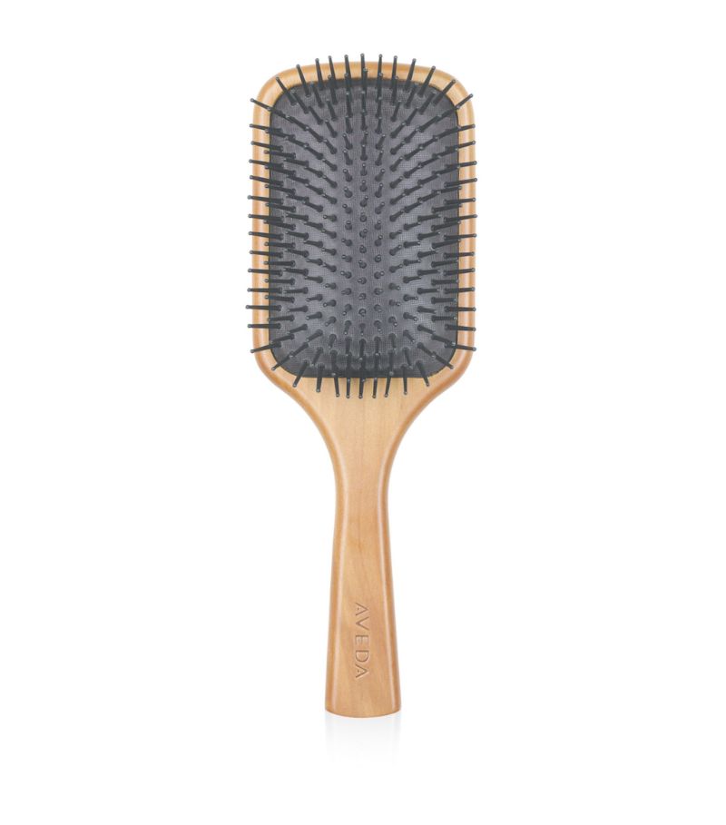 Originally created for scalp treatments and detangling, this professional brush features extended br