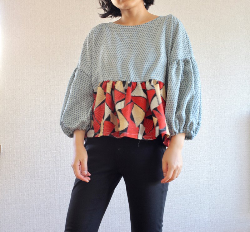 一款現代設計的和服上衣，蓬鬆的氣球袖設計。