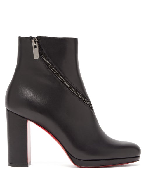 Christian Louboutin - The striking red soles that anchor these Birgitta boots were inspired by the r