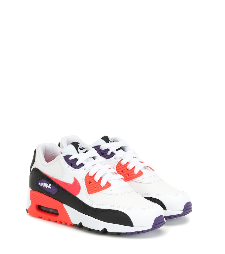 Tiny toes will love this petite pair of Air Max 90 sneakers from Nike Kids.