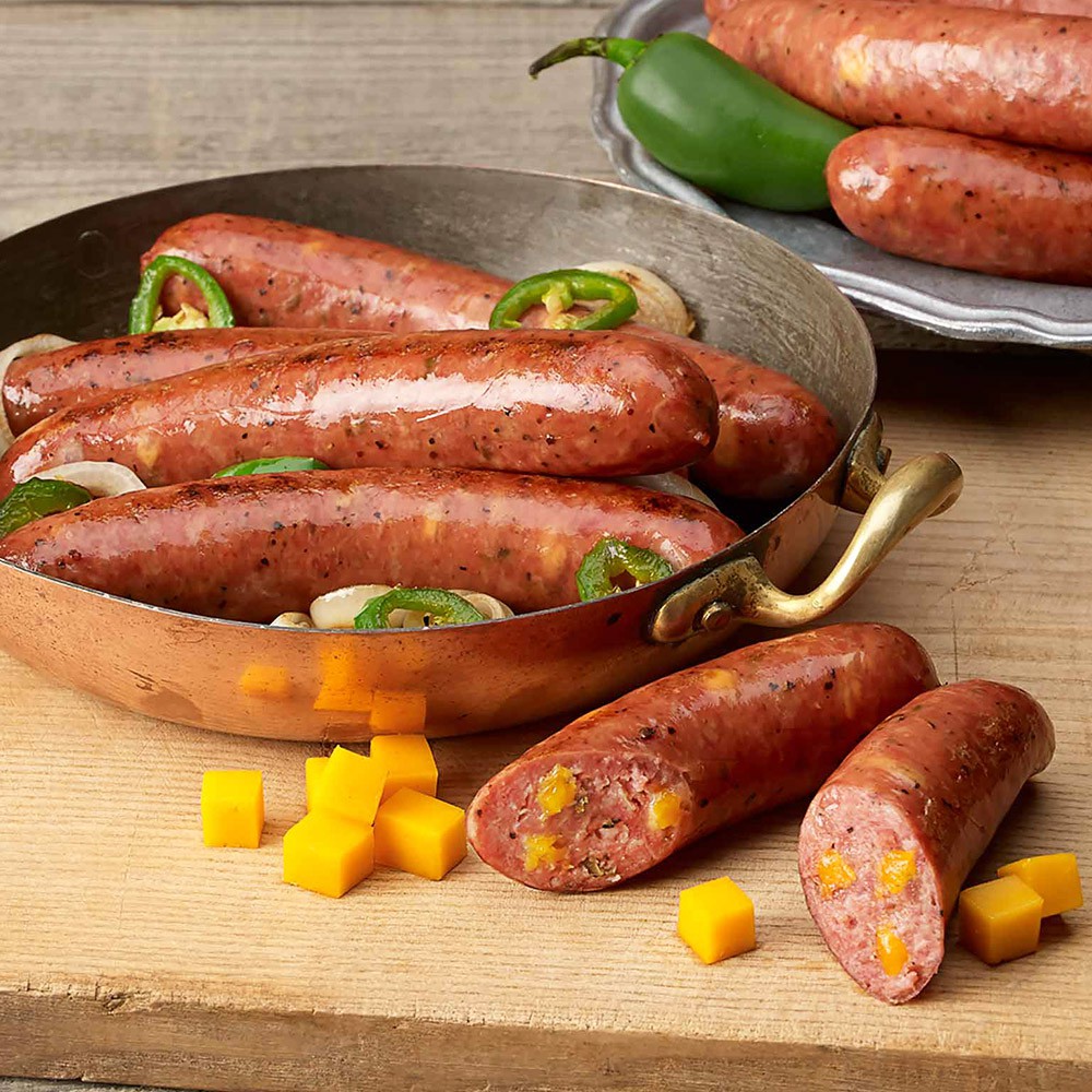●巧達起司味道香濃●點心、正餐都可以§§食用方式：本商品為熟食！充分解凍後即可食用；或水煮、微波加熱後食用！商品品名：台畜巧達起司香腸商品重量：250g±10%/5根/包商品成分：豬肉、水、雞肉、膠原