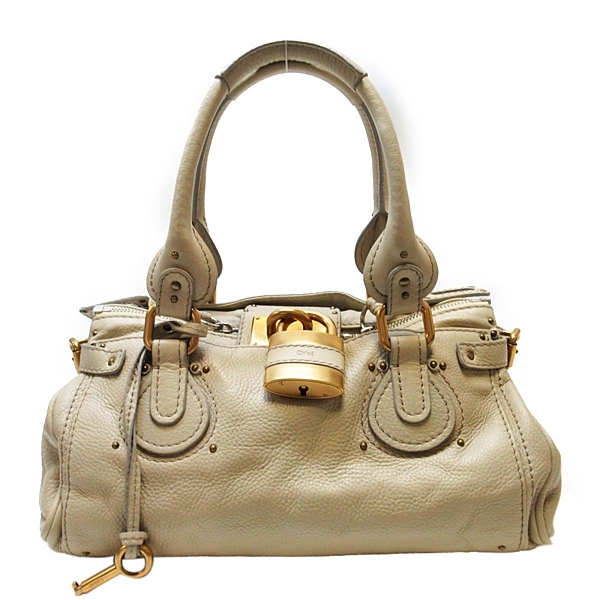 九成新 整體有使用感 金屬有些微髮絲紋 皮革及內裡有些微髒汙