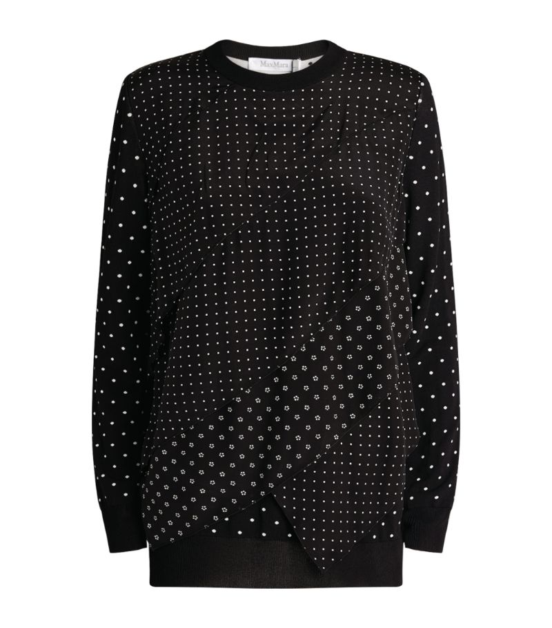 Proving the polka dot is now a mainstay as opposed to a trend, the Alex sweater by Max Mara infuses 