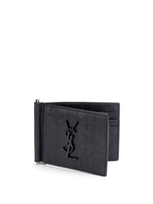 Bifold wallet in textured leather; Six inside card slots; One inside money clip; 4.5