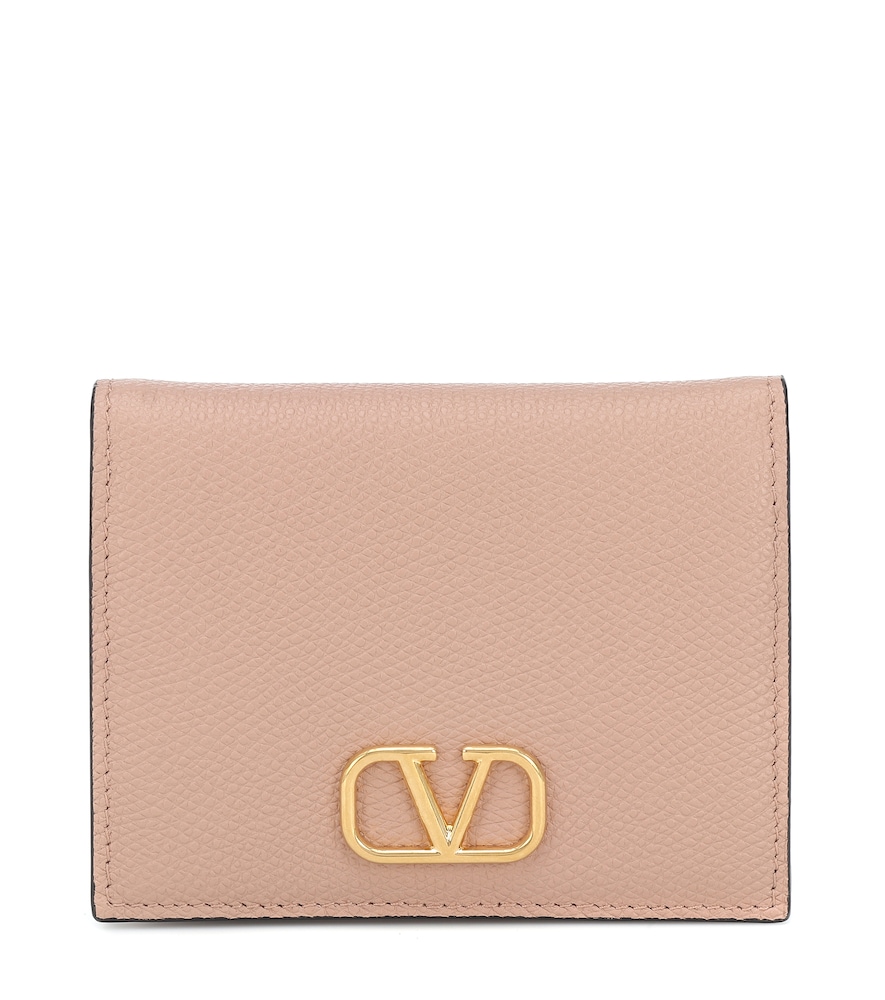 Valentino Garavani's new VLOGO defines this beige wallet.