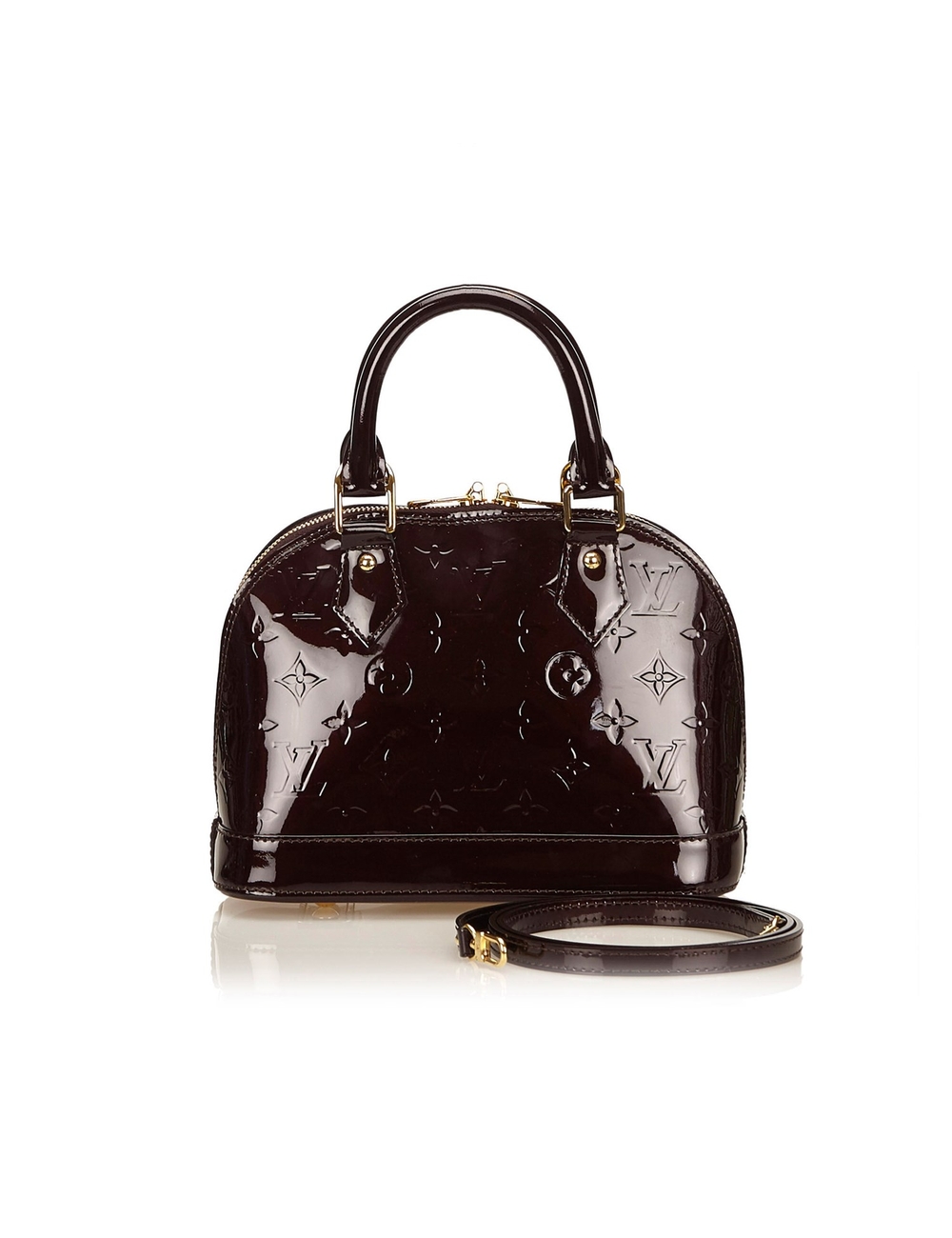 The Alma BB features a vernis leather body, rolled handles, a top zip closure and an interior slip p